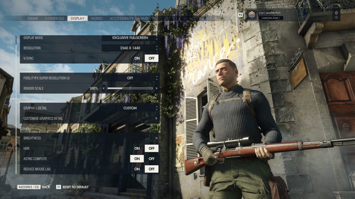 The Sniper Elite 5 Options Menu. In the Display tab, the “Display”, “Resolution Scaling”, “Quality” and “Other” sub-sections are visible. On the right is a preview of Karl in an environment to preview setting changes.