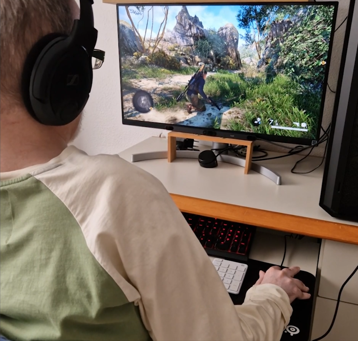 An over the shoulder shot of Antonio Martinez who plays Sniper Elite 5 with a specialised gaming set up.