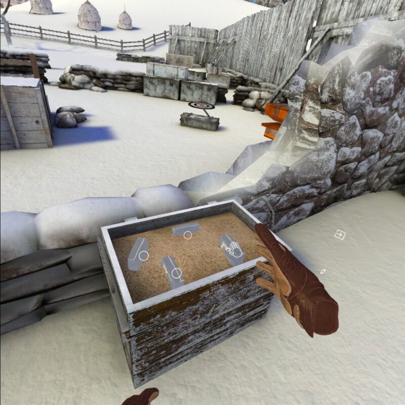 Gameplay of Winter Warrior showing the player examining a crate with objects in it. There are white circles on each object and one has a hand icon. There is also a small compass icon next to the players right hand, and a square with an arrow pointing into it further to the right.