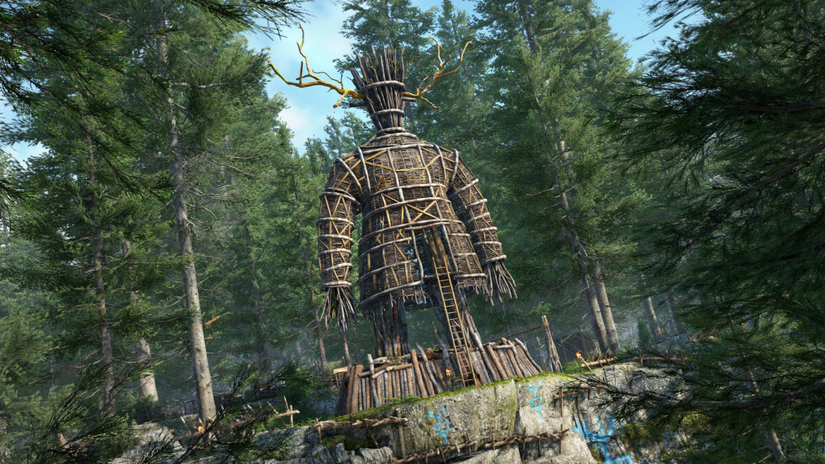 A screenshot from Atomfall, Showing The Wicker Man standing tall surrounded by large trees at the top of a tree.